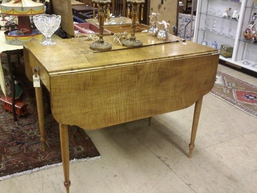 Appraisal: DROP LEAF TABLE Curly maple having shaped leaves drawers on