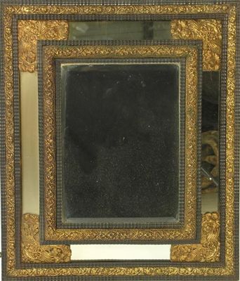 Appraisal: A Dutch ebonised and gilt brass mounted cushion frame mirror