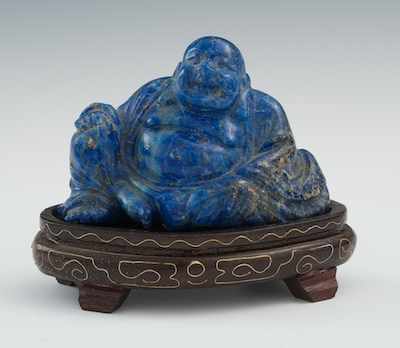 Appraisal: A Carved Lapis Happy Buddha The seated figure measures apprx