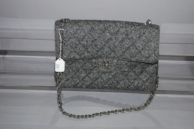 Appraisal: Chanel black white wool tweed handbag with chain strap and