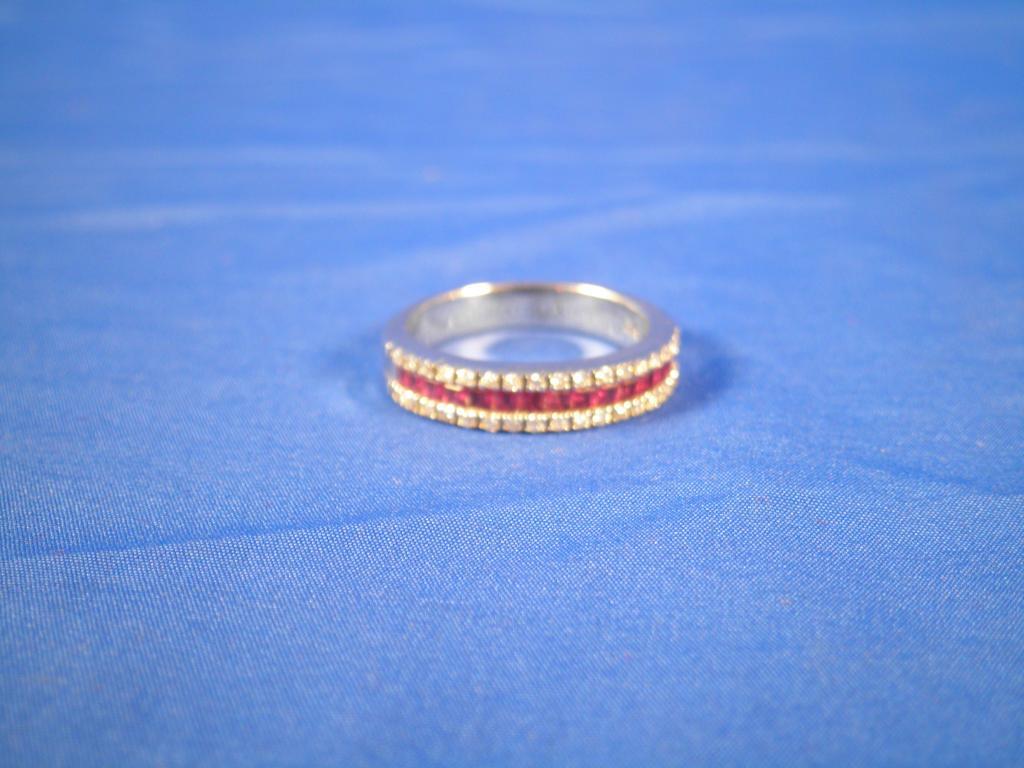 Appraisal: A ruby and diamond eternity type ring with baguette cut