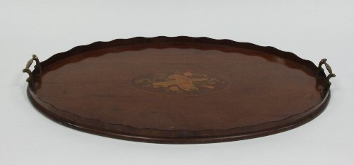 Appraisal: An oval inlaid tray with ivory galleried edge and brass