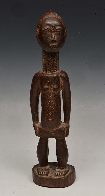 Appraisal: A BAULE OR TAGWANA HARDWOOD FEMALE FIGURE with incised decoration