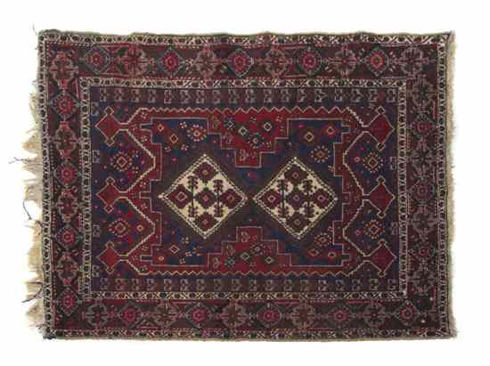 Appraisal: A Northwest Persian Wool Rug having two diamond form medallions