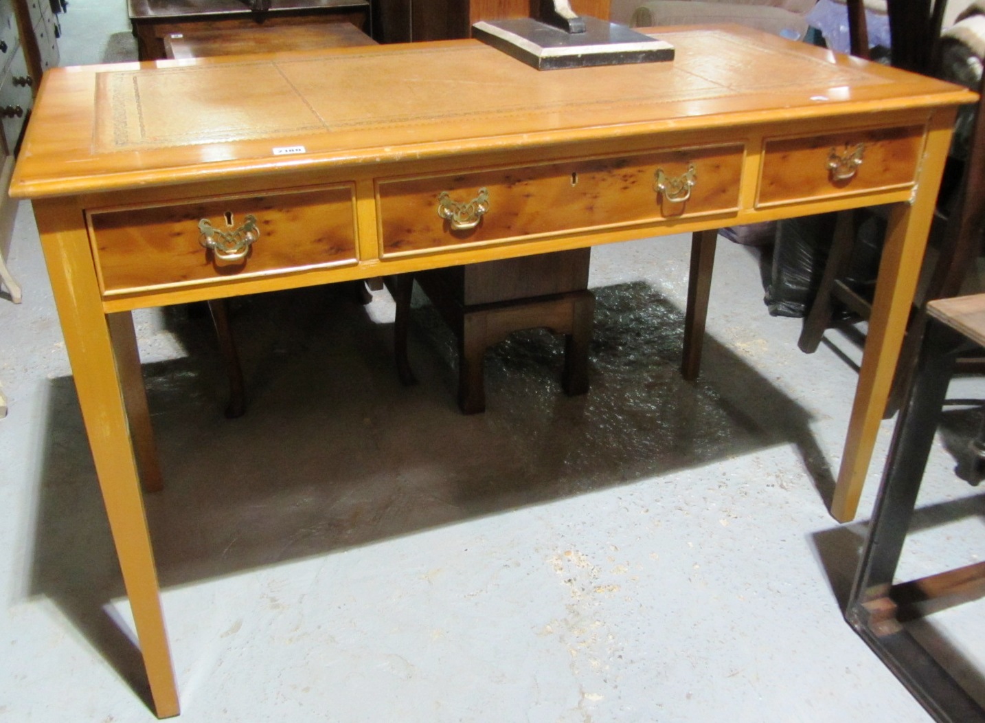 Appraisal: A th century yew writing table with gilt tooled inset