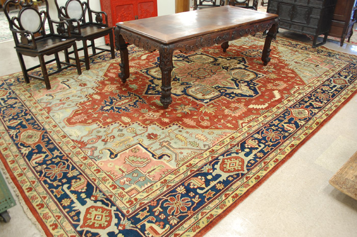 Appraisal: HAND KNOTTED ORIENTAL CARPET Persian Serapi design stylized floral and