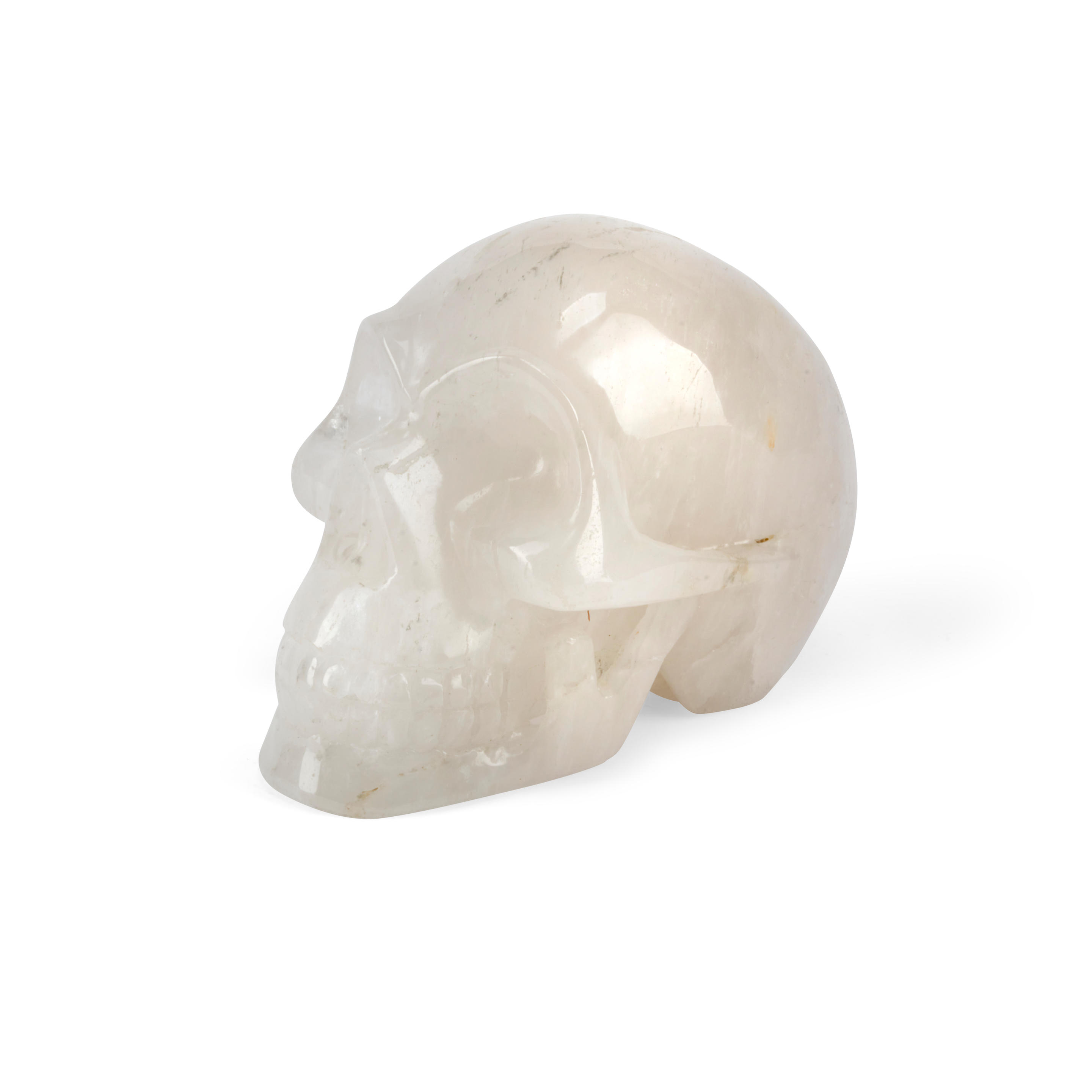 Appraisal: A CARVED ROCK CRYSTAL SKULL height in cm width in