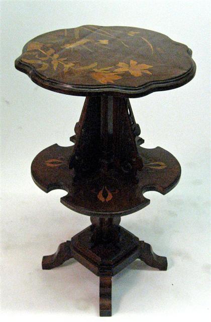 Appraisal: AFTER GALLE Art nouveau two tiered stand Walnut with maple