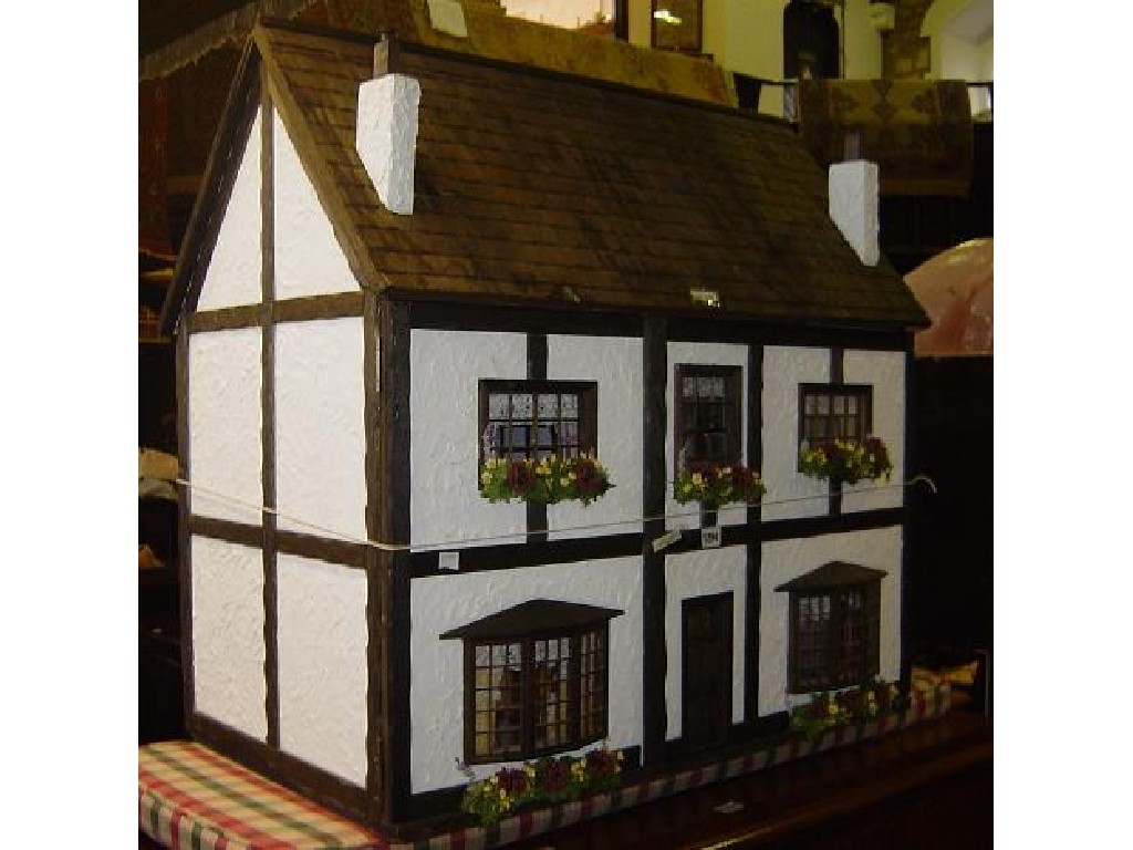 Appraisal: A large contemporary dolls house with mock tudor facade with