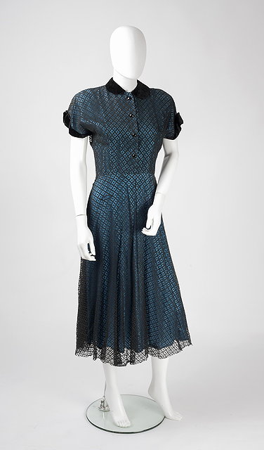 Appraisal: An occasion dress with turquoise blue lining and sheer black