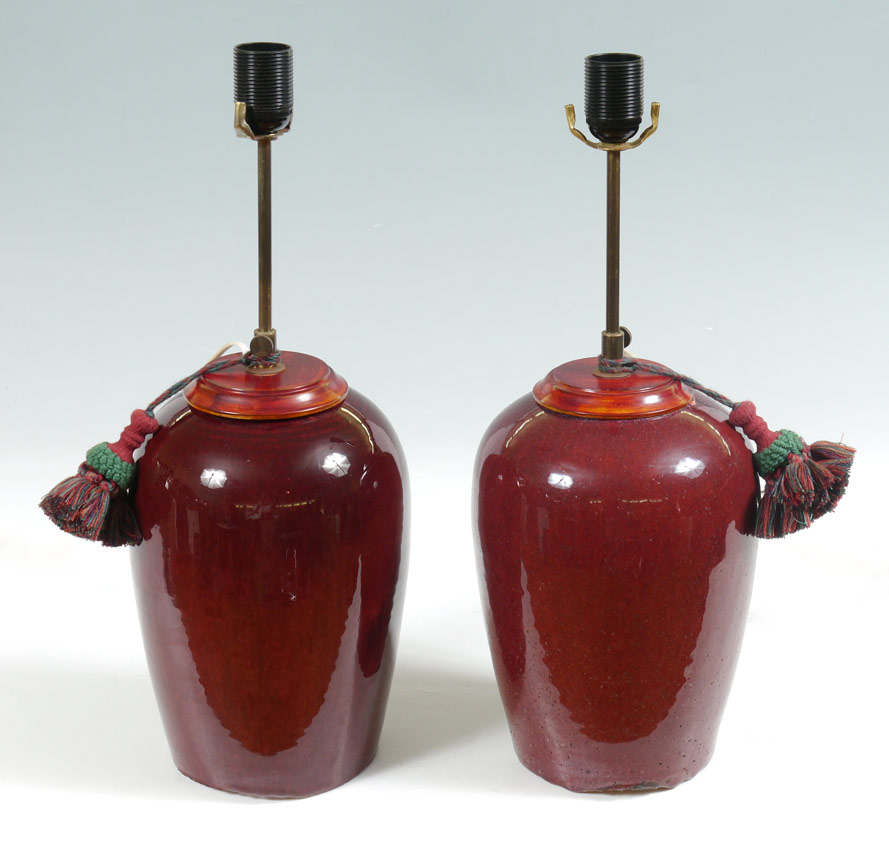 Appraisal: PAIR OXBLOOD EARTHENWARE CHINESE LAMPS Earthenware bases with oxblood speckled