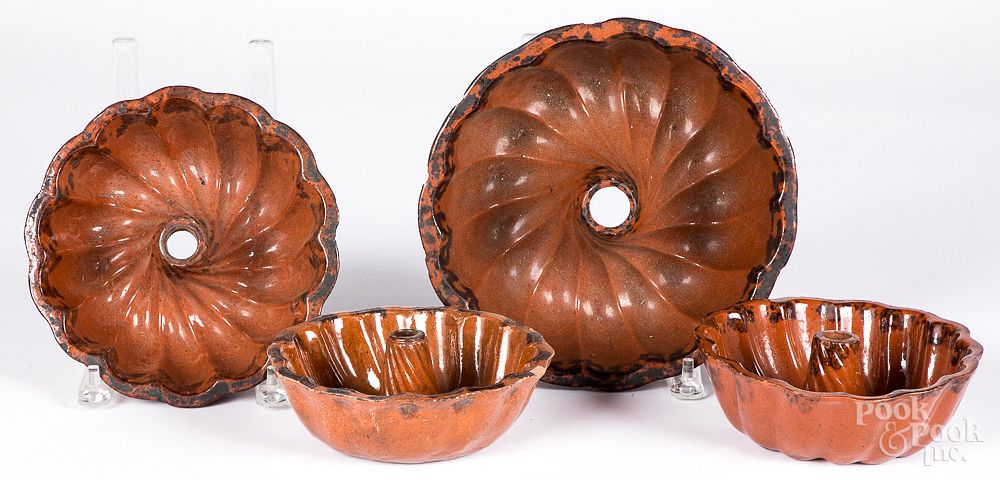 Appraisal: Four redware molds th c Four redware molds th c