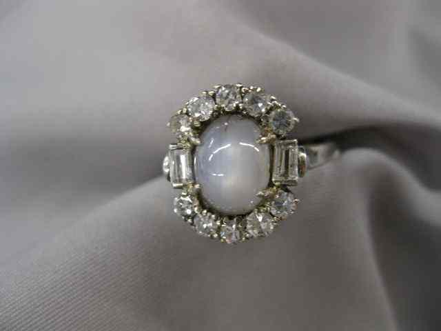 Appraisal: Star Sapphire Diamond Ring carat gray cabochon surrounded by diamonds