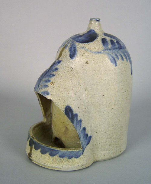 Appraisal: Pennsylvania stoneware chicken feeder th c with a wide band