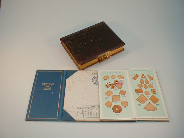 Appraisal: A leather embossed photograph album and a Crawfords biscuits desk