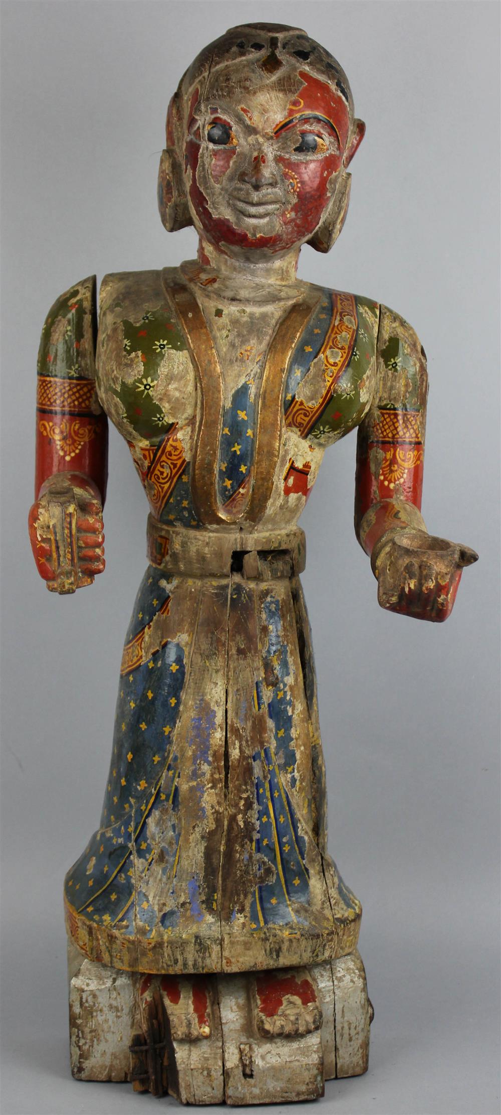 Appraisal: INDIAN POLYCHROME PAINTED WOOD FIGURE the attendant fashioned of various