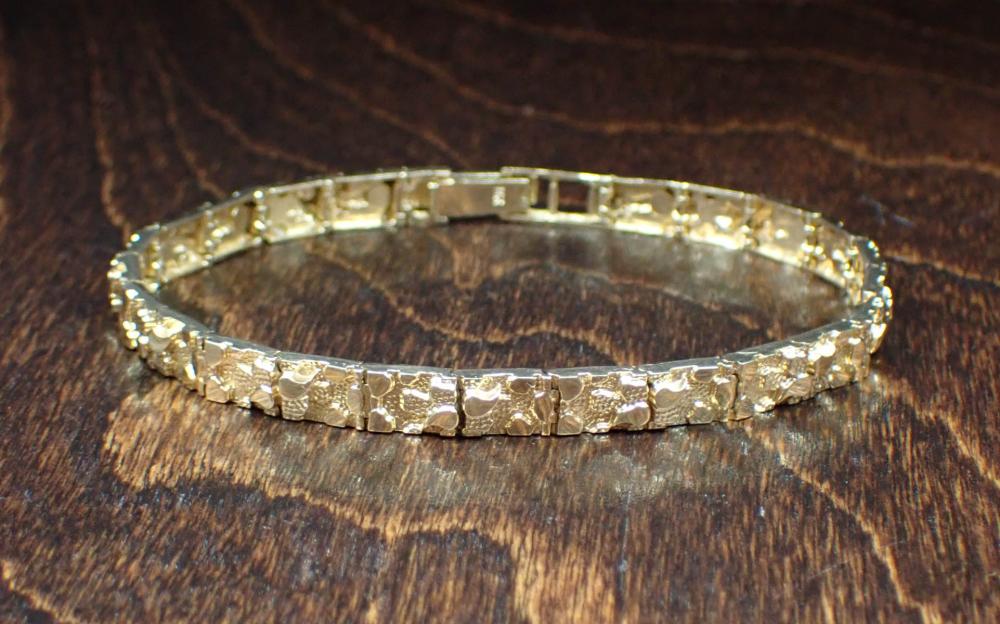 Appraisal: FOURTEEN KARAT YELLOW GOLD BRACELET The k gold nugget motif