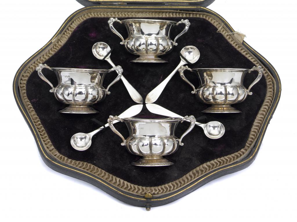 Appraisal: A SET OF FOUR GEORGE V TWO-HANDLED SALTS AND SPOONS