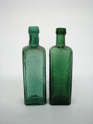 Appraisal: Two Wishart's Pine Tree antique bottles including cordial in green