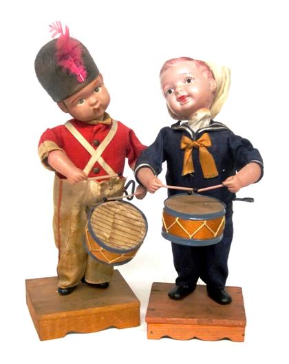 Appraisal: Two Japanese celluloid drummer boy wind-up toysThe first dressed in