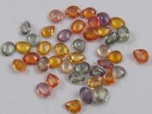 Appraisal: A quantity of loose polished sapphires mixed colours total weight