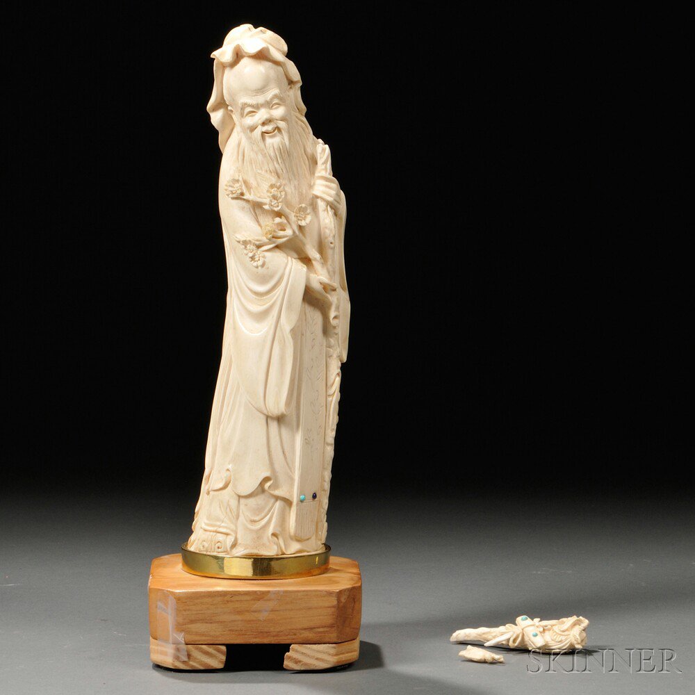 Appraisal: Ivory Carving China depicting Shoulou holding a flowering branch and