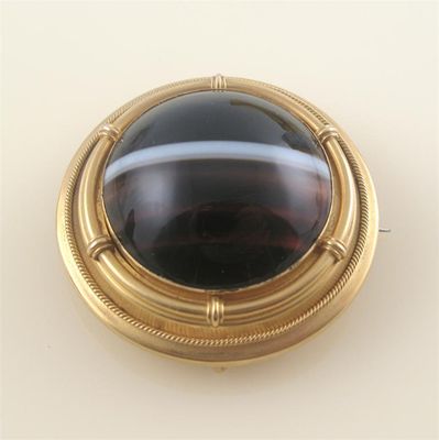 Appraisal: A Victorian agate brooch centred with a circular banded agate