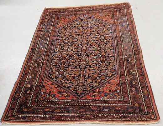 Appraisal: Persian oriental center hall carpet with floral patterns and a