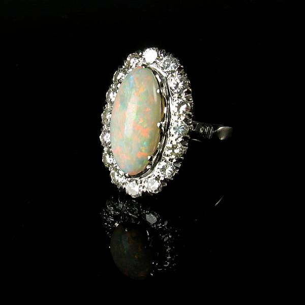 Appraisal: An opal diamond and k white gold ring an oval