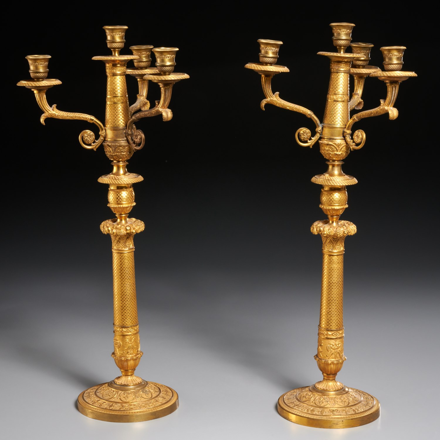 Appraisal: PAIR FRENCH RESTAURATION GILT BRONZE CANDELABRA th c the tapered