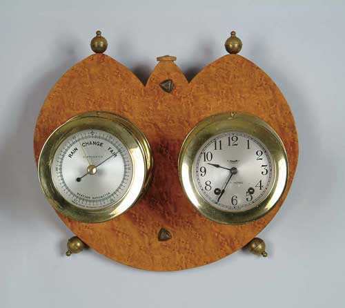 Appraisal: A FINE BRASS BAROMETER AND CLOCK SET The brass round