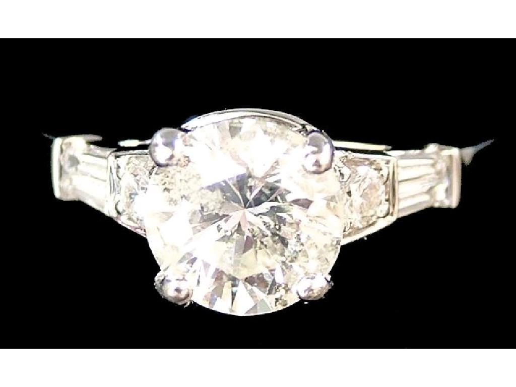 Appraisal: ct white gold diamond solitaire brilliant cut ring with baguette