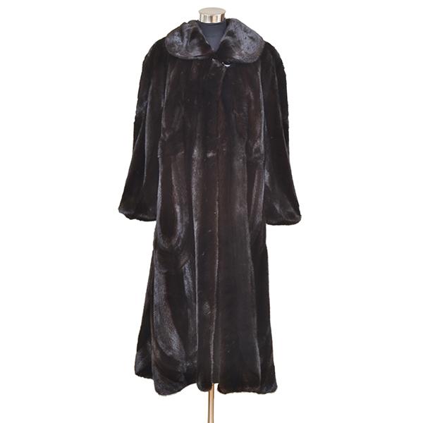 Appraisal: A FULL LENGTH BLACK AND BROWN PANELLED MINK COAT