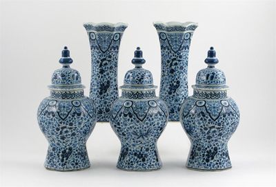 Appraisal: A Dutch Delft garniture of three vases and covers and