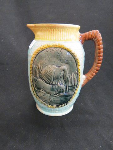 Appraisal: Majolica Pottery Pitcher with Hound Heron decor excellent