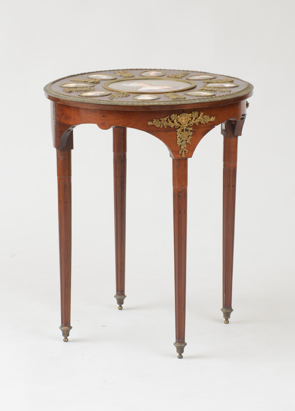 Appraisal: NAPOLEON III GILT-BRONZE-MOUNTED MAHOGANY AND PORCELAIN CENTER TABLE Porcelain plaques