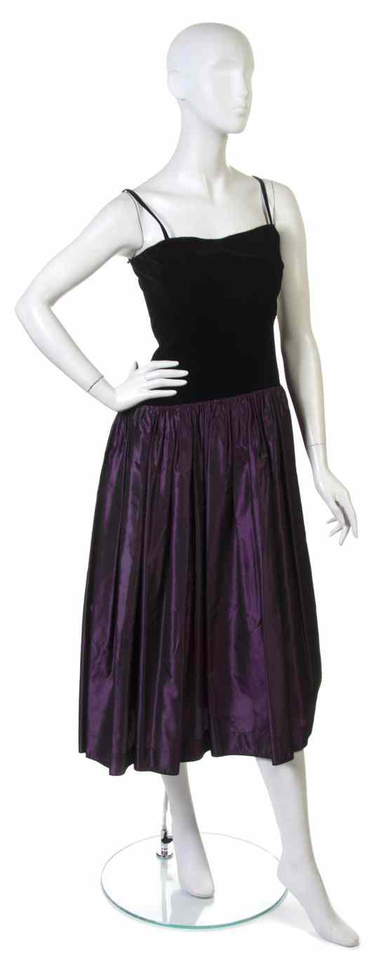 Appraisal: An Yves Saint Laurent Black Velvet and Purple Silk Evening