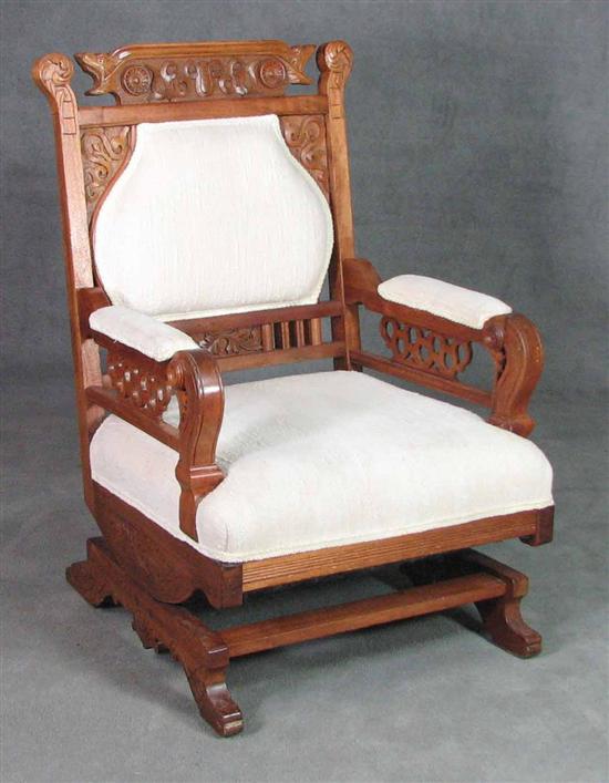 Appraisal: Victorian Walnut Platform Rocking Armchair Circa Foliate and geometric carving