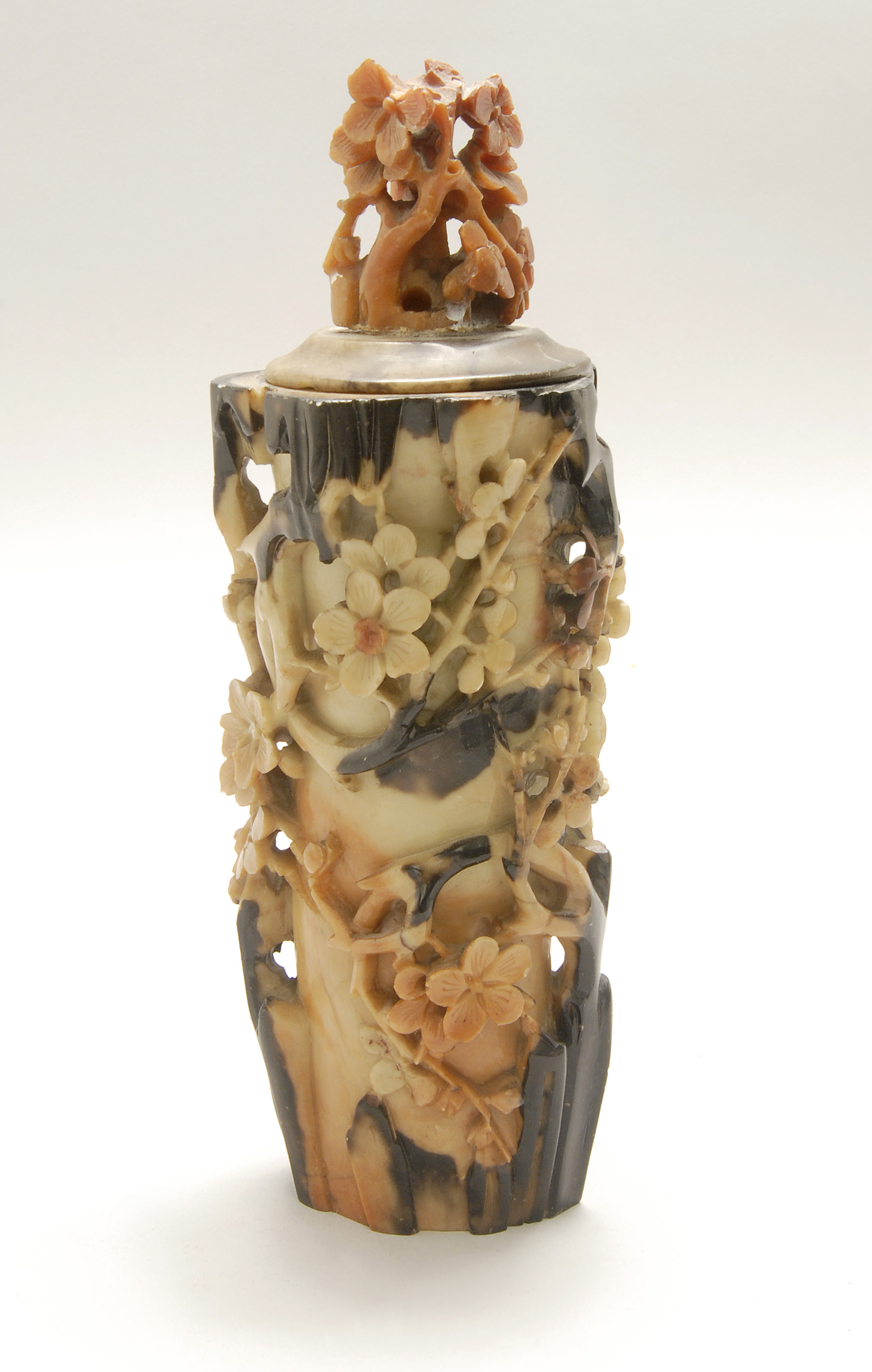 Appraisal: TWO-COLOR SOAPSTONE COVERED VASE Circa In tree stump form with