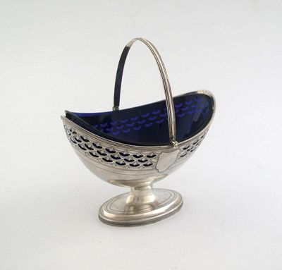 Appraisal: A George III boat shaped sugar basket with a swing