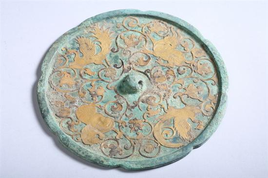 Appraisal: CHINESE BRONZE MIRROR Tang Dynasty With fu lion and bird