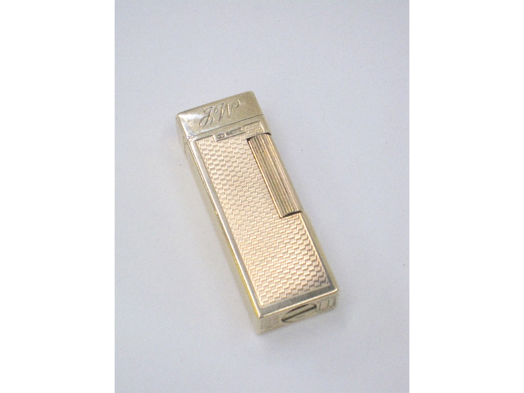 Appraisal: ct gold Dunhill cigarette lighter with engine turned decoration operate