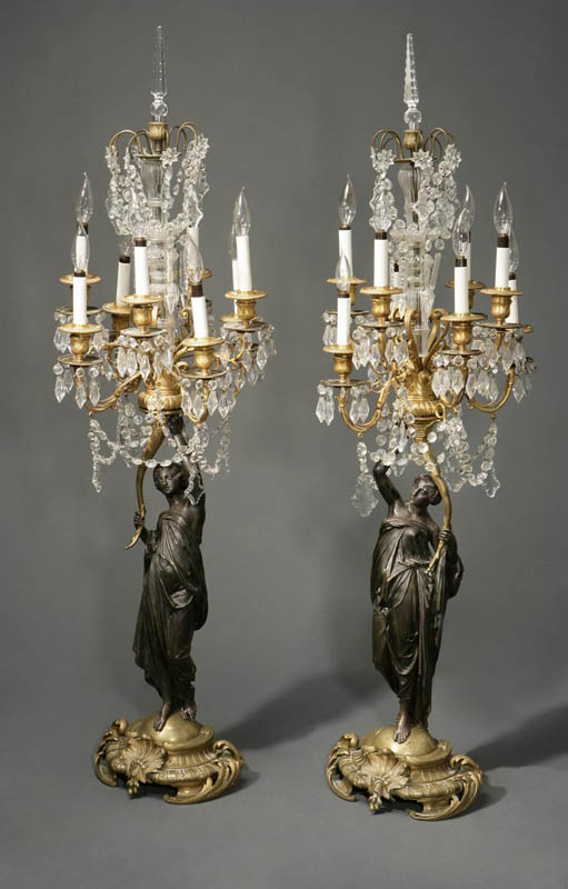 Appraisal: A pair of Louis XV XVI style figural candelabra A