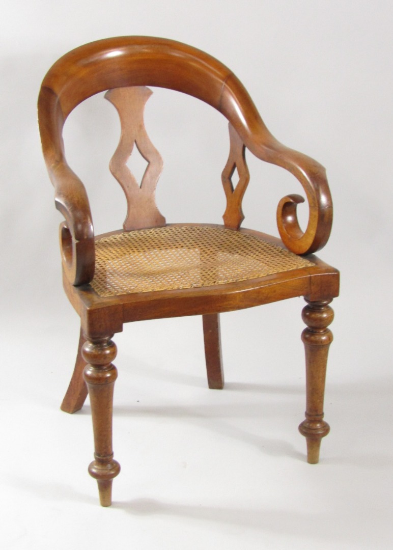 Appraisal: A Victorian mahogany smoker's bow chair with pierced splat scrolling