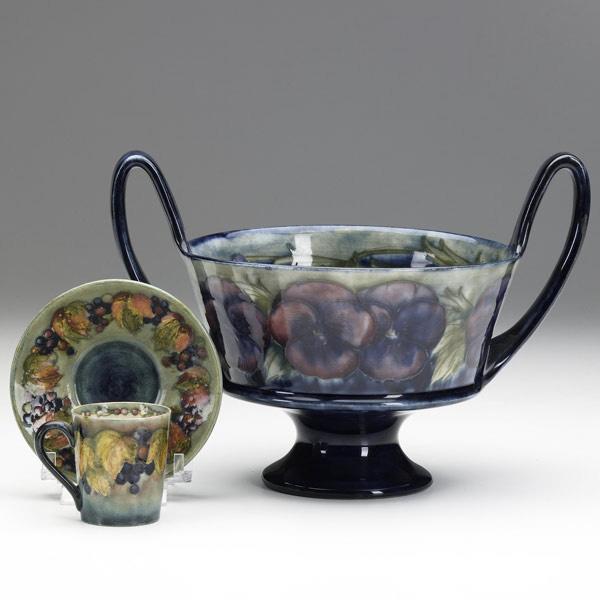 Appraisal: MOORCROFT Three items footed two-handled coupe in the Pansy pattern