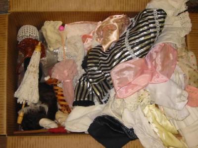 Appraisal: A quantity of dolls' accessories including shoes parasols and clothing