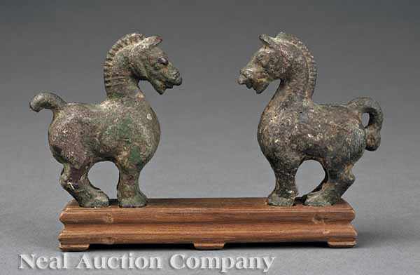 Appraisal: A Pair of Chinese Bronze Horse Figures Han Dynasty BC