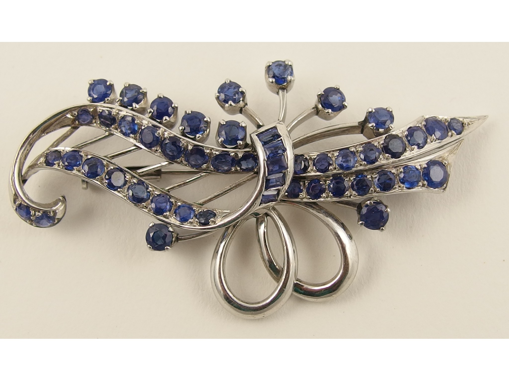 Appraisal: A sapphire broochset with approximately cts of round brilliant cut