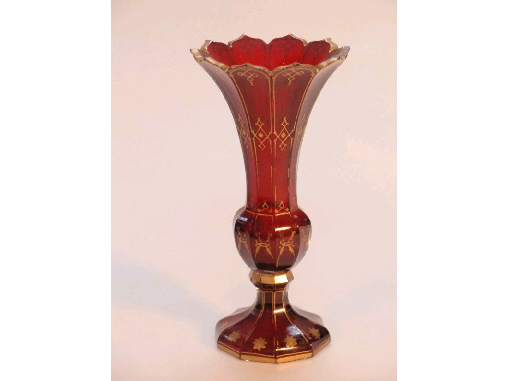 Appraisal: A Victorian Bohemian ruby glass vase with faceted flared body