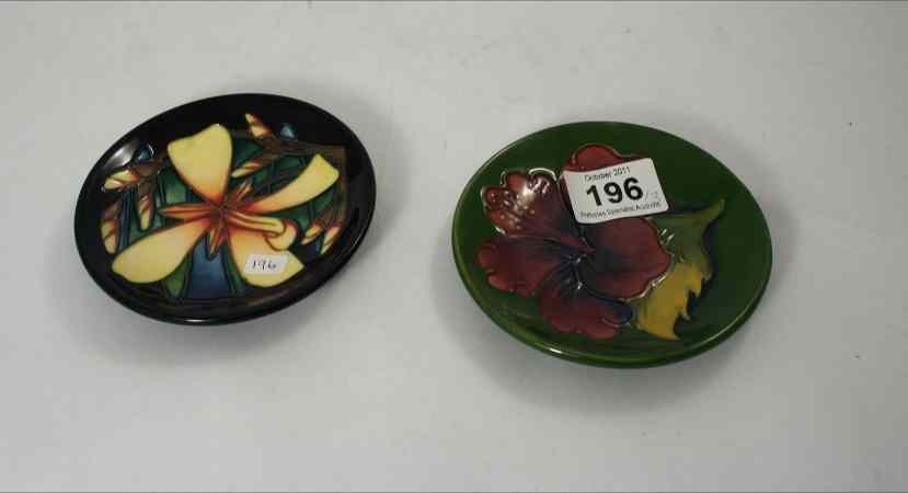 Appraisal: Moorcroft Dishes decorated in Hibiscus and Spanish Lily Lily is